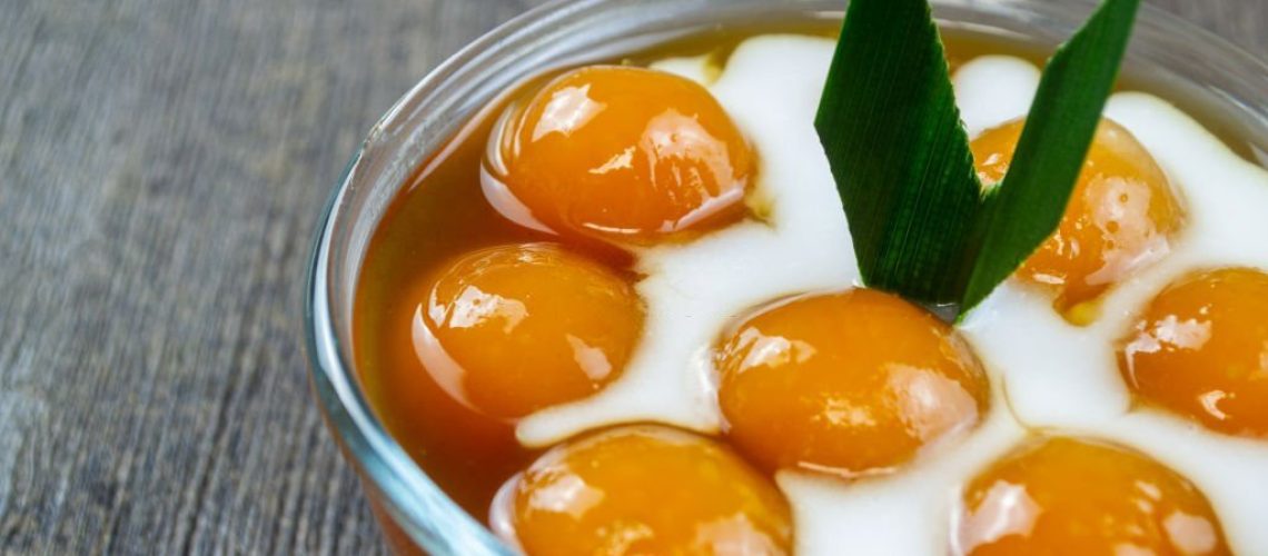 Kolak biji salak ubi kuning, indonesian dessert made from sweet potatoes and sago flour which are shaped into rounds, then boiled. 
It has a delicious and chewy taste